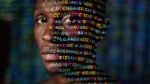 A Black man's face with projections of letters implying genomic markers.