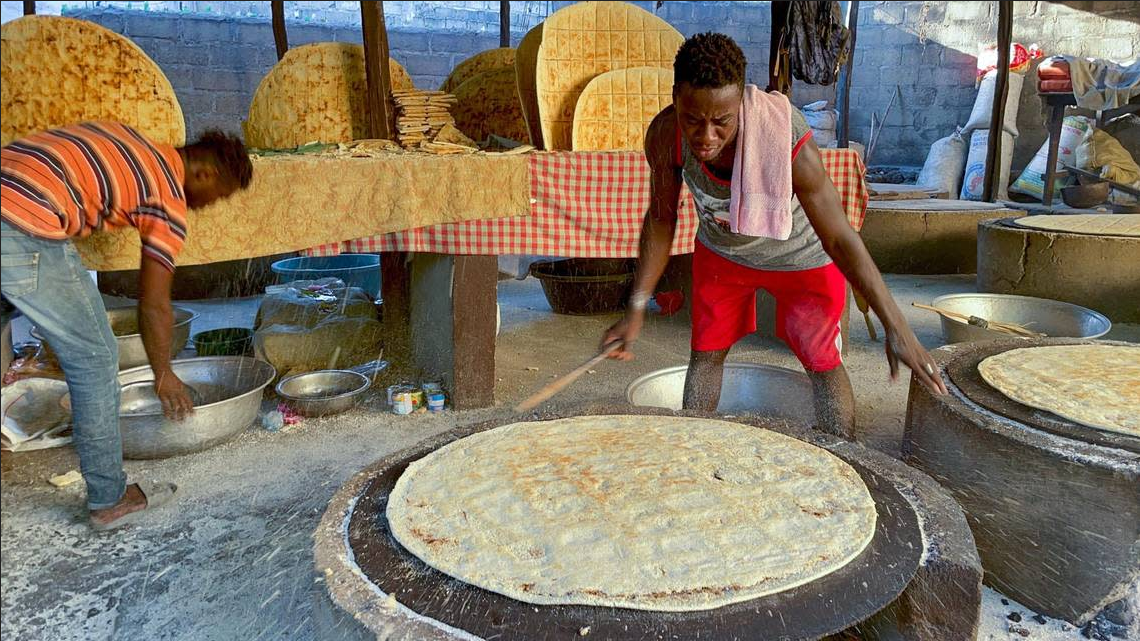 Josnel Pierre pepares kasav flatbread in Haiti, on Friday, Jan. 20, 2023. The staple food, which has no fat or sourdough, is still prepared the way it was made centuries ago.